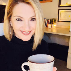 Picture of Jill Carlyle holding white mug