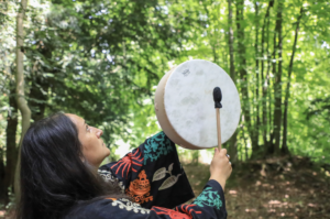 Women's Empowerment Ceremony - picture of Angie Litvinoff banging a drum.