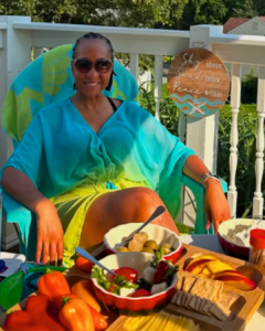 Picture of Wendy sitting in a chair looking relaxed and slowing down