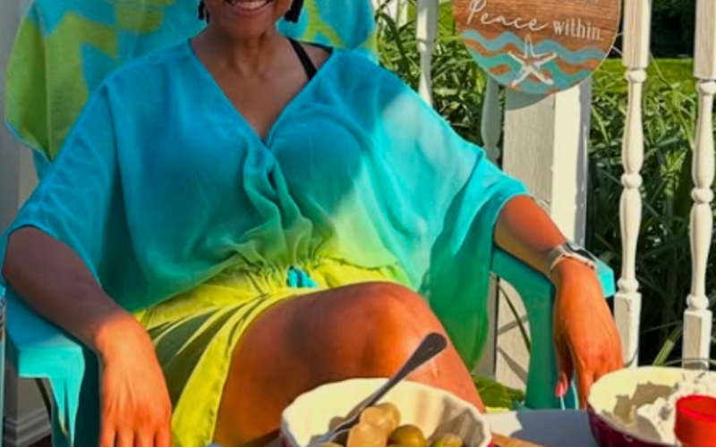 Picture of Wendy sitting in a chair looking relaxed and slowing down