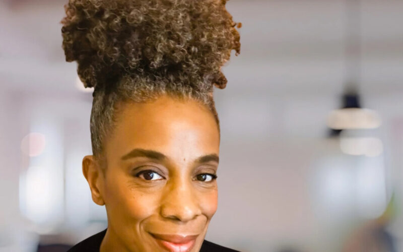 Reinventing looks different for each of us. Picture of Oneika Mays smiling into the camera