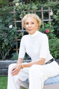 The courage to choose yourself can change the trajectory of your life. It has for Deborah Santana, pictured looking at the camera wearing a white sweater and pants
